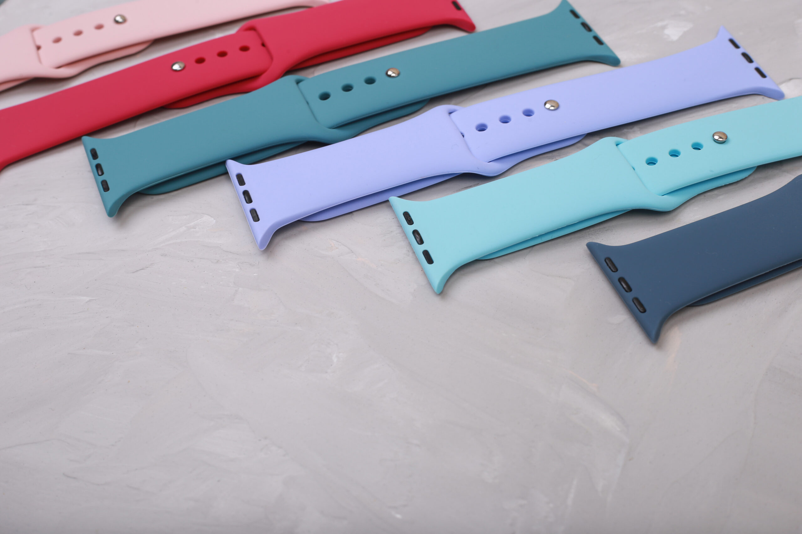 Silicone,Straps,For,Smart,Watches,On,A,Stone,Background.,Flat